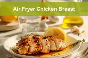 Air Fryer Chicken Breast on plate with golden chicken pieces lemon balsamic glaze