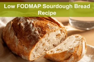 Low FODMAP Sourdough Bread Recipe finished loaf on white napkin and glass of water