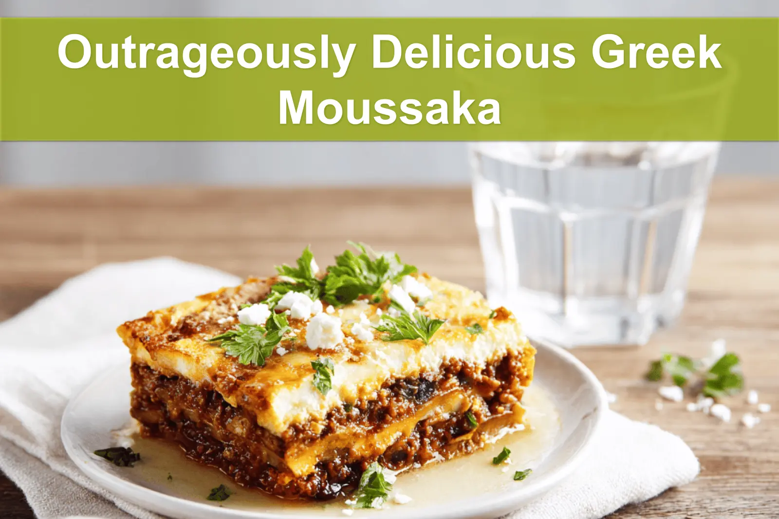 Outrageously Delicious Greek Moussaka with golden topping fresh herbs clean white napkin
