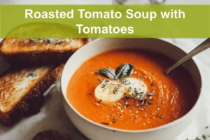 Roasted Tomato Soup with Tomatoes in bowl with grilled cheese basil under warm natural light