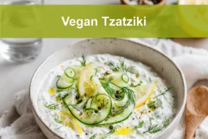 Vegan Tzatziki in ceramic bowl with cucumber dill lemon and olive oil drizzle