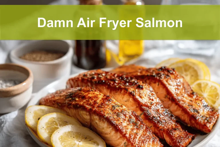 Damn Air Fryer Salmon plated with lemon slices honey soy glaze olive oil bottle beside glass