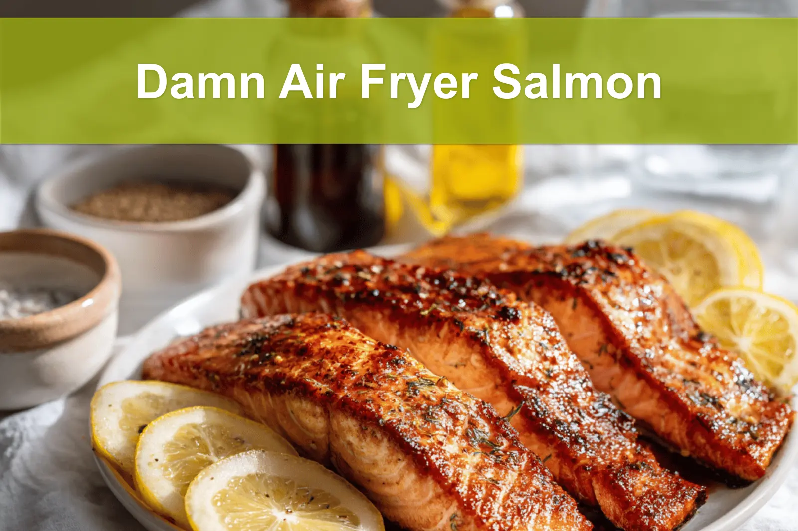 Damn Air Fryer Salmon plated with lemon slices honey soy glaze olive oil bottle beside glass