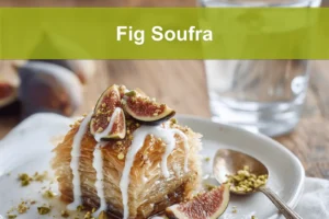 Fig Soufra plated with fresh figs, pistachios, honey glaze, creamy white sauce, warm tones