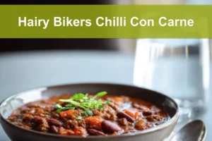 Hairy Bikers Chilli Con Carne hearty bowl on white napkin with glass of water