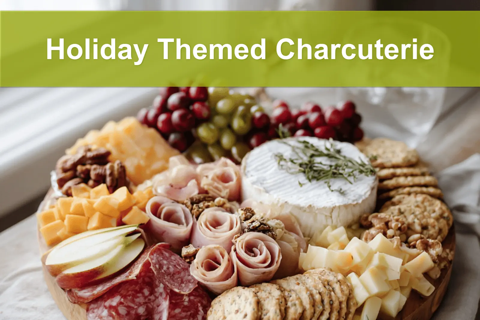 Holiday Themed Charcuterie board with salami prosciutto aged cheddar brie grapes apples and herbs