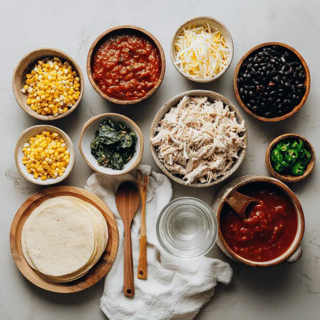 Ingredients for Crockpot Chicken Enchilada Casserole including cheese, tortillas, chicken, enchilada sauce and beans
