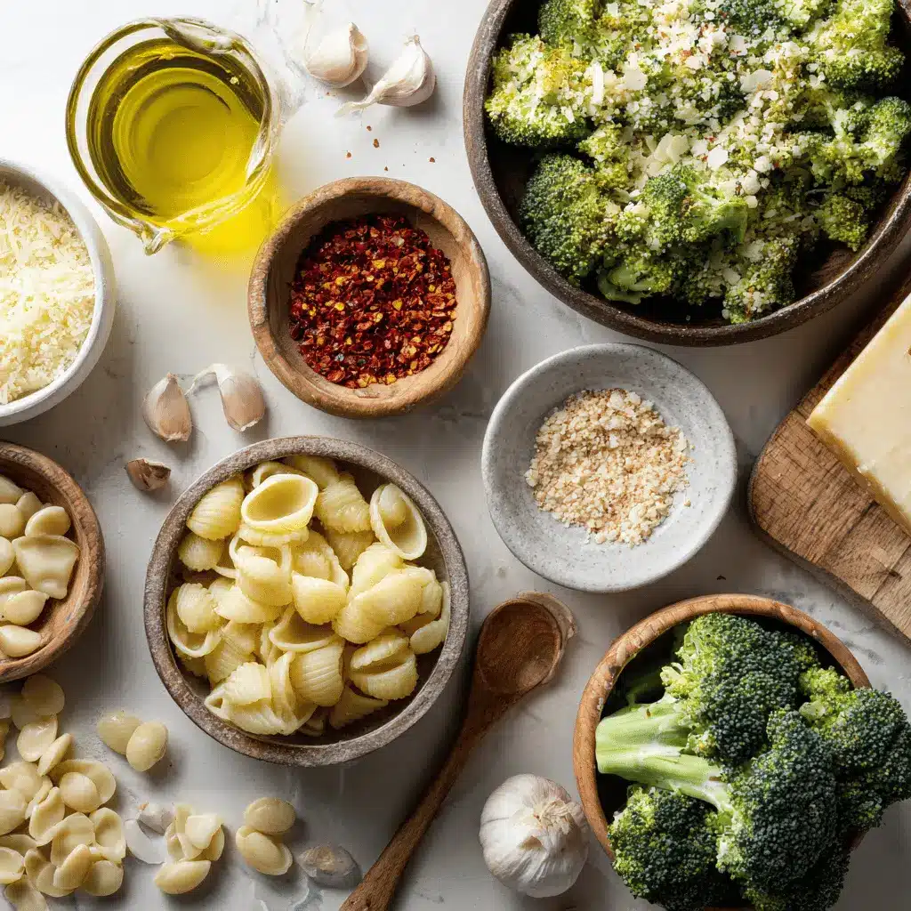 Ingredients for light and healthy broccoli pasta including broccoli florets garlic parmesan cheese shell pasta and olive oil