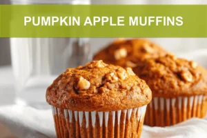 PUMPKIN APPLE MUFFINS hero shot three quarter angle warm tones on white cloth