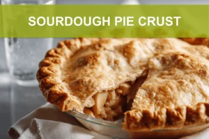 SOURDOUGH PIE CRUST golden flaky crust on white napkin with clear water glass hero image