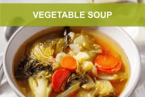 VEGETABLE SOUP overhead hero image on white cloth napkin warm natural lighting