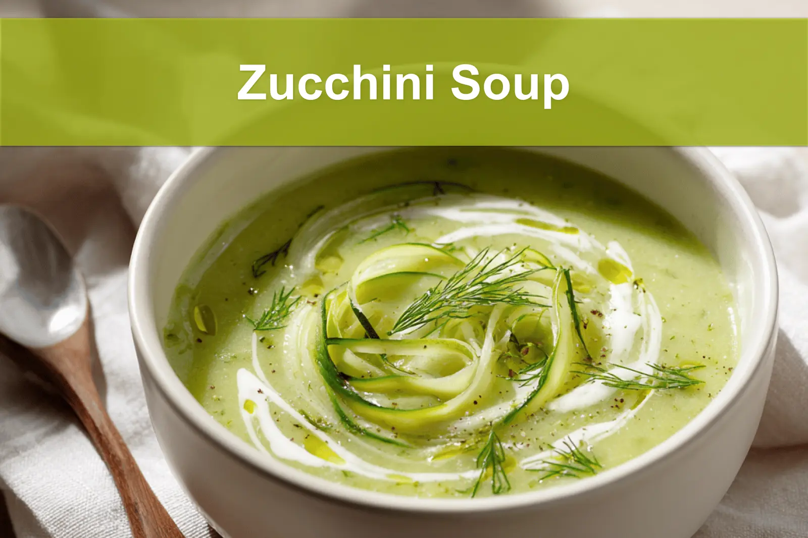 Zucchini Soup garnished with dill in white bowl on cloth beside clear water glass