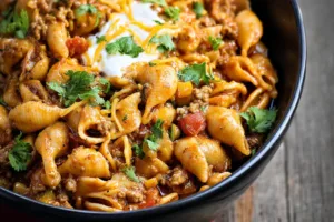 Cheesy Taco Pasta Crockpot recipe, served and ready to eat, easy homemade dinner
