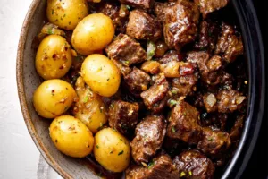 Slow Cooker Garlic Butter Beef Bites Potatoes recipe, served and ready to eat, easy homemade dinner